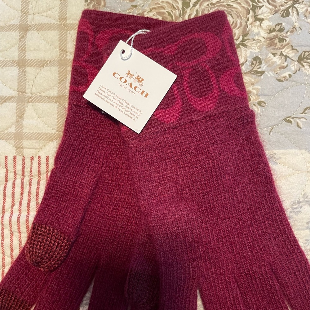 Coach knit gloves. Cranberry/red color. Thumb touchscreen. One size. Brand new.